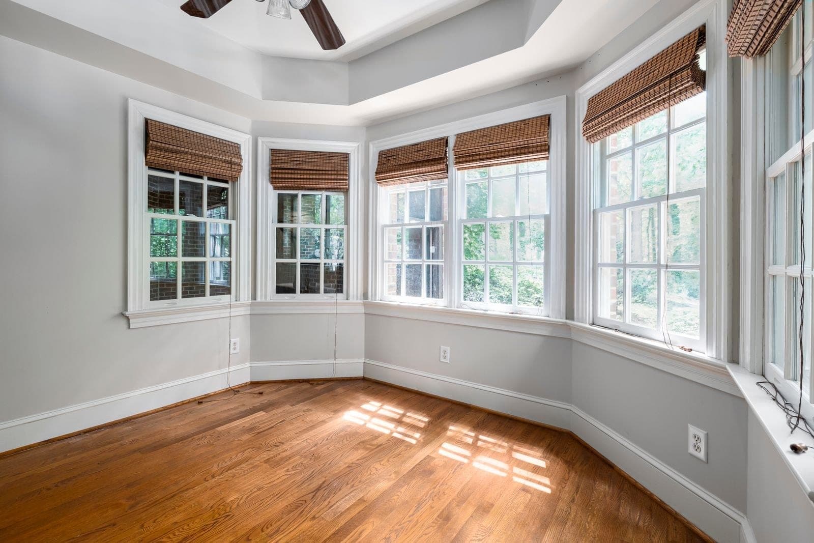 Empty room with a curved run of windows forming a bow window